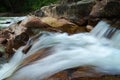 Tropical river motion flowing through wet and mossy rock Royalty Free Stock Photo
