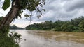 Tropical Riverbanks and Monsoon Clouds Royalty Free Stock Photo