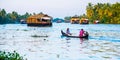 Tropical riverscape with a boat and houseboats