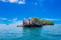 Tropical rock island against blue sky and sea Royalty Free Stock Photo