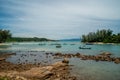 Tropical rocky beach with boats in lagoon. Thailand. Ocean. Summer. Hills.