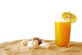 Tropical sandy beach, fruit cocktail and seashells Royalty Free Stock Photo