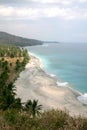 Tropical sandy beach with palm trees at sunny day. Lombok island
