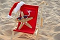 Santa Starfish on a red beach chair Royalty Free Stock Photo