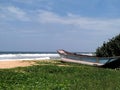 Tropical sea, beach and canoe on the shore ,Ahungalle, Sri Lanka. Royalty Free Stock Photo