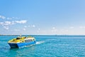 Tropical sea, ferry and Cancun skyline Royalty Free Stock Photo