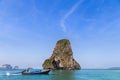 Tropical sea with limestone rock and longtail boat at railay beach krabi Thailand