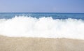 Tropical sea sand beach on clear sunny day. View of the sea and waves from a tropical beach on hot summer day Royalty Free Stock Photo