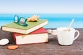 Tropical sea seen from the boat. Book and  coffee on table. Reading and relaxing on vacation Royalty Free Stock Photo