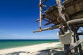 tropical sea view under wooden hut at sunny day. sandy beach and blue sky Royalty Free Stock Photo