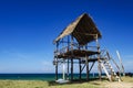 Tropical sea view under wooden hut at sunny day. sandy beach and blue sky. Royalty Free Stock Photo