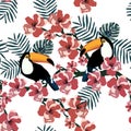 Tropical seamless pattern with cute birds,leafs and flowers.Summer vector background with toucans.Textile texture