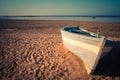 Tropical Seascape with a fishing boat on beach on warm sunset, S Royalty Free Stock Photo