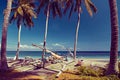 Tropical Seascape with a wooden, old fishing boats on white beach on warm sunset. Traditional asian boat. Wooden fishing boats on Royalty Free Stock Photo