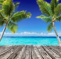 Tropical Seascape With Wooden Plank And Palm Trees On The Turquoise Ocean