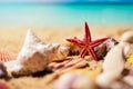 Tropical seashells and starfish on sunny exotic beach sand and ocean in background Royalty Free Stock Photo