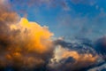 a tropical sky with colorful cumulus clouds