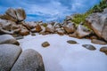 Tropical small secret pristine white sand beach surrounded by granite boulders. Anse Marron beach, La Digue, Seychelles