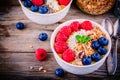 Tropical smoothie bowl with raspberries, blueberries, chia seeds and almonds Royalty Free Stock Photo