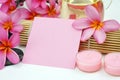 Tropical spa setting white pink paper note on white background Royalty Free Stock Photo