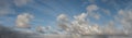 Tropical storm formation drifting across blue sky panorama Royalty Free Stock Photo