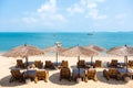 Tropical style of table ,chairs and umbrella in beach cafe Royalty Free Stock Photo