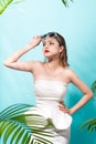 Tropical summer holiday fashion beauty concept. Summer style portrait of young attractive asian woman. Royalty Free Stock Photo