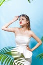 Tropical summer holiday fashion beauty concept. Summer style portrait of young attractive asian woman. Royalty Free Stock Photo