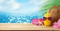 Tropical summer holiday vacation concept with pineapple juice, beach fashion bag and flip flops on wooden table over sea beach Royalty Free Stock Photo