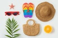 Tropical summer vacation concept with fashion bag beach hat, flip flops and plam tree leaf on white background. Top view from Royalty Free Stock Photo