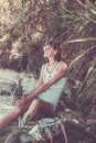 Tropical summer woman with pineapple. Outdoors, ocean, nature. Bali island paradise. Indonesia.