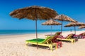 Umbrellas and Lounge chairs Tropical sunny beach in GOA, India