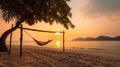 Tropical sunset beach background as summer landscape panorama with beach swing or hammock and white sand and calm sea beach Royalty Free Stock Photo