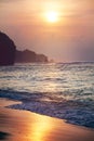 Tropical sunset beach background, seashore line and waves