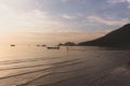 Tropical sunset in the beach with kid running Royalty Free Stock Photo