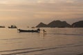 Tropical sunset in the beach with kid running Royalty Free Stock Photo