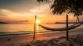 Tropical sunset beach and sky background as exotic summer landscape with beach swing or hammock and white sand and calm sea beach