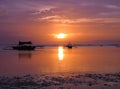 Tropical sunset with fishing boats Royalty Free Stock Photo