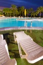 Tropical swimming pool area in vertical view Royalty Free Stock Photo