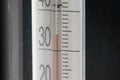 Tropical temperature of 34 degrees Celsius, measured on an outdoor thermometer Royalty Free Stock Photo