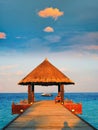 Tropical thatched roof Pavilion sunset, Maldives Royalty Free Stock Photo