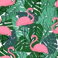 Tropical trendy seamless pattern with flamingos and palm leaves.