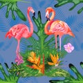 Tropical trendy seamless pattern with pink flamingos and mint green palm leaves Royalty Free Stock Photo