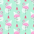 Tropical trendy seamless pattern with pink flamingos, watermelon and palm leaves on mint green background. Royalty Free Stock Photo