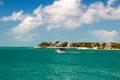 Small motorboat on tropical blue waters of the Sunset Key resort island in the city of Key West, Florida, USA