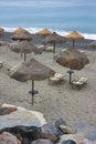 Tropical umbrella on Palinuro beach in Campania, Italy to indicate a tourism concept