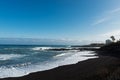 Tropical unusual exotic beach with black volcanic sand. Puerto de la Cruz, Tenerife, Spain Royalty Free Stock Photo