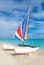 Varadero beach in Cuba with a colorful catamaran sailboat Royalty Free Stock Photo