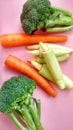 Tropical vegetables consist of green broccoli, baby corn and carrots