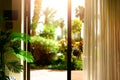 Tropical view background. Summer, travel, vacation and holiday concept. Open window, door and white curtain with blurred Royalty Free Stock Photo